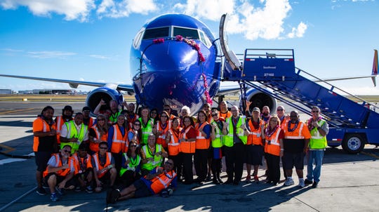 A Southwest Airlines Boeing 737-800 is celebrated in Honolulu on February 5, 2019, after the carrier's first landing in the Hawaiian Islands, with employees in celebration. The flight was part of a certification effort needed to begin passenger service.