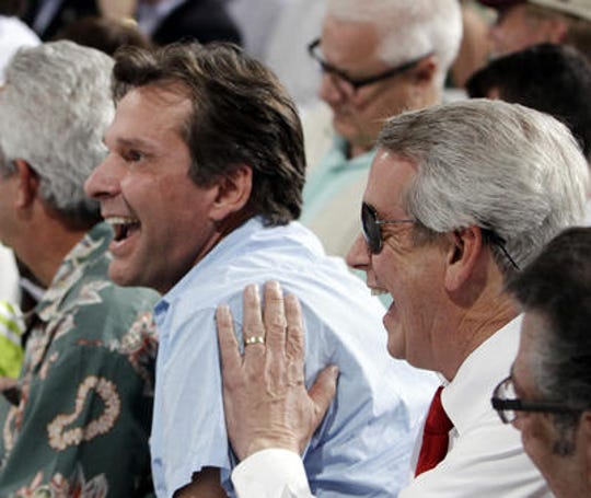 Dr. Kendall Hansen (left) reacts in 2012 at the Kentucky Derby after his horse with owner James Shircliff (right) is placed in the No. 14 post position.