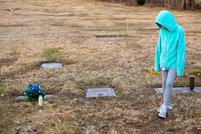 Kassandra Ramos, 11, looks at her cousin's grave at Mount Rose Cemetery in Spring Garden Township. Dante Mullinix, 2, suffered fatal injuries on Sept. 6, 2018. He was one week away from his 3rd birthday. But his life was as tragic as his death.
