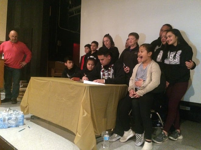 South Salem's Diego Fuimaono signs a letter of intent Wednesday to play football at Southwest Minnesota State.