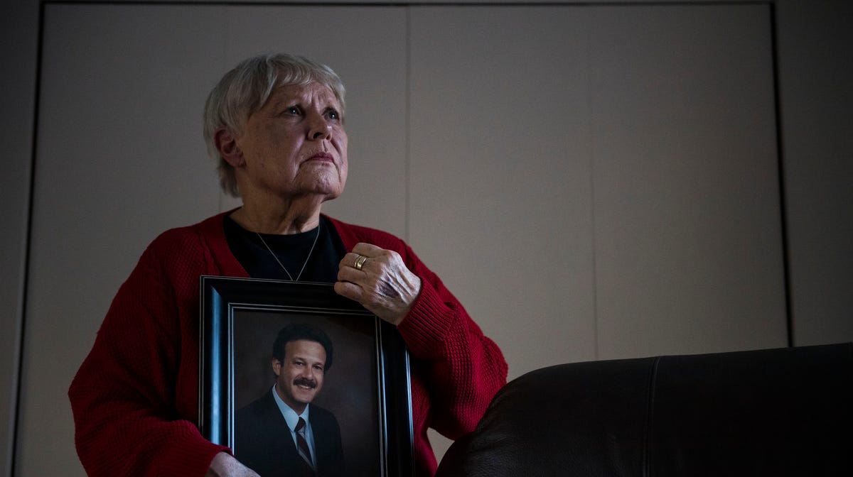 Chris Winokur poses for a portrait with a photo of her late husband, former Fort Collins City Councilman and Mayor, Robert Winokur, on Thursday, Jan. 31, 2019, in Estes Park, Colo.
