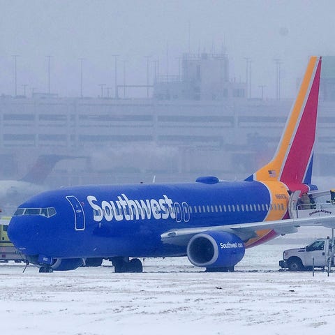 Passengers exit Southwest Airlines Flight 1643...