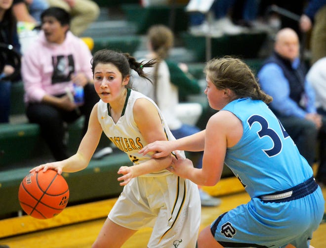 CMR's Lauren Lindseth attempts to dribble by Great Falls High's Ryen Palmer in the girls crosstown basketball game at the CMR Fieldhouse, Thursday night.