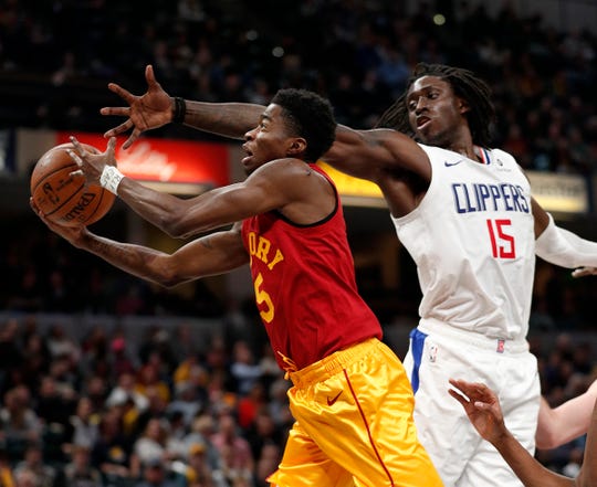 Indiana Pacers guard Edmond Sumner (5) drives by LA Clippers forward Johnathan Motley (15) in the second half of their game at Bankers Life Fieldhouse on Thursday, Feb. 7, 2019.