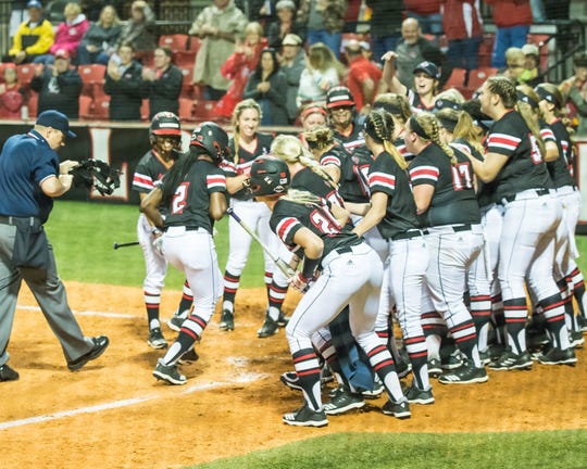The UL Ragin' Cajuns welcome Raina O'Neal (2) back to home plate after hitting the Cajuns' first home run as the Ragin' Cajuns play Fordham in the opening game of the 2019 softball season at Lamson Park on Thursday, Feb. 7, 2019.
