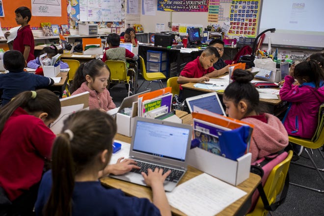 Second-graders work in Robin Watson's class on Feb. 7, 2019, at Longfellow Elementary in Mesa, Ariz.