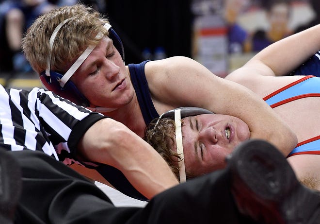 Dallastown's Jarrett Feeney earns back points on Father Judge's Zachary Bayer during a 195-pound bout of a PIAA Team Wrestling Championships first-round match at Hershey's Giant Center on Thursday, Feb. 7. This weekend's District 3 Individual Championships were also originally slated for the Giant Center, but were moved to Hersheypark Arena to make way for a concert. John A. Pavoncello photo