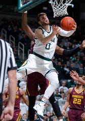 Kyle Ahrens of Michigan State goes to basket against Minnesota on Feb. 9 in East Lansing.
