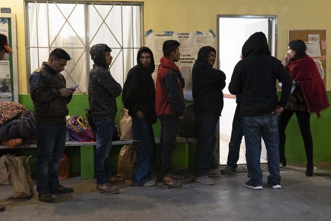 Migrants from Central America in a Tijuana, Mexico, February 2019, wait to meet with U.S. immigration officials.