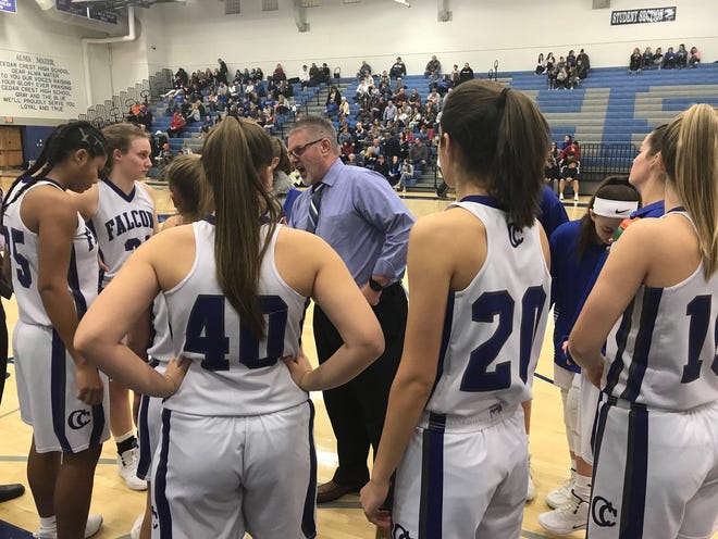 Cedar Crest girls basketball coach Jim Donmoyer speaks to his team prior to the second half of Saturday's L-L quarterfinal win over Lampeter-Strasburg.