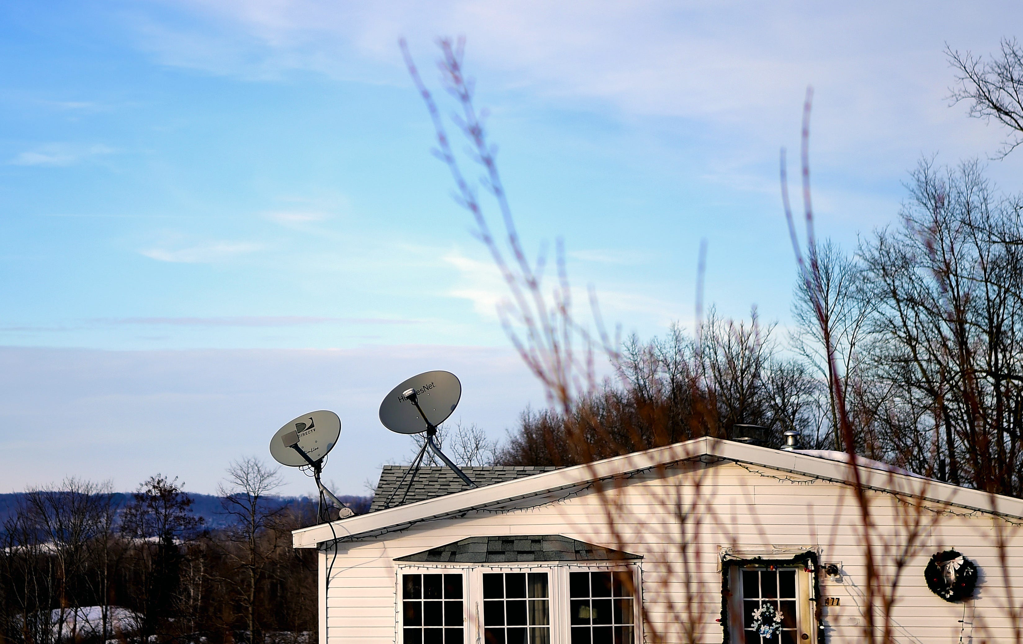 Many residents in rural Steuben County, NY, rely on satellite dishes for television, as digital services are often not available due to unreliable internet. January 28, 2019.