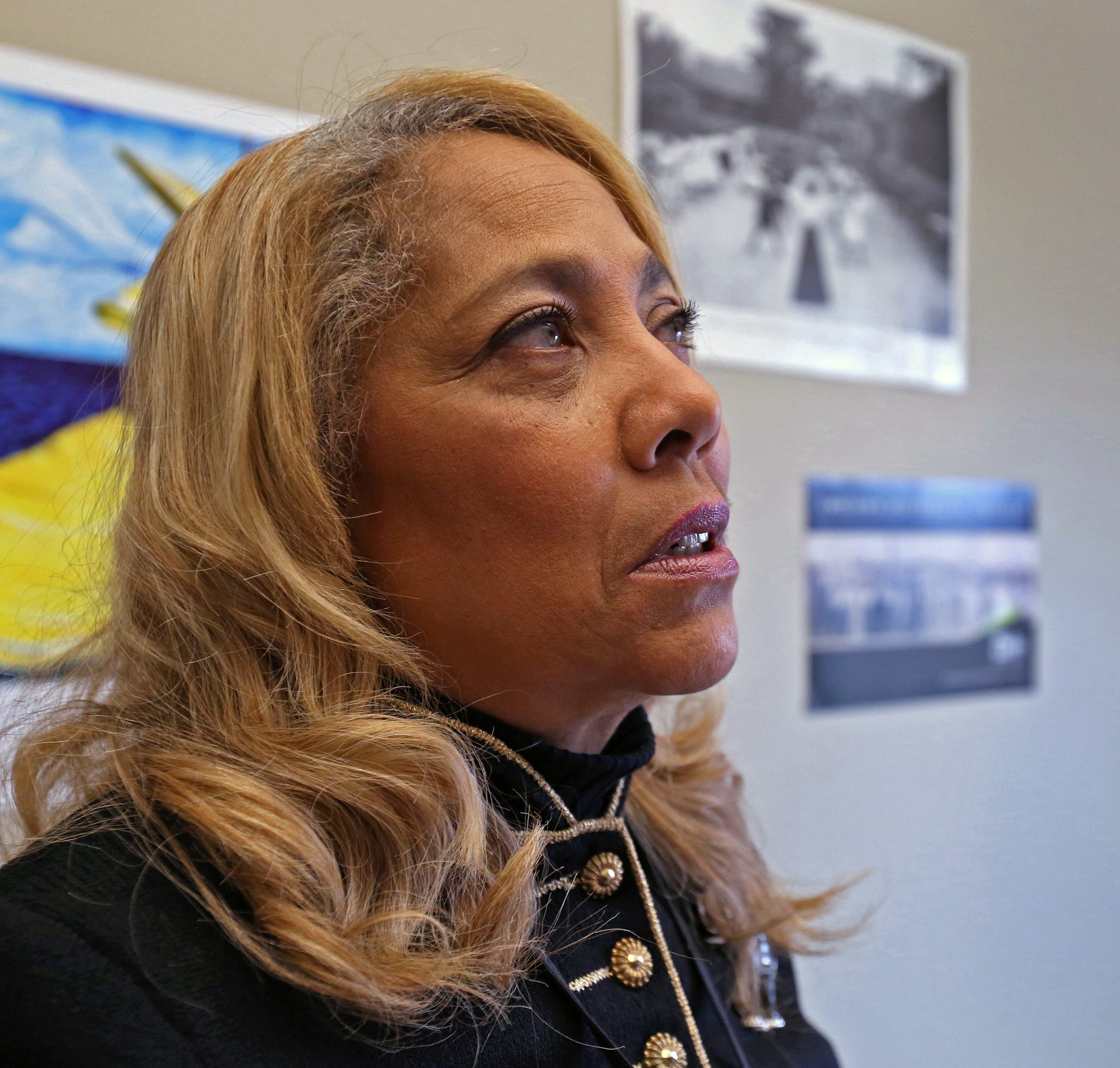 Susan Hall Dotson, Coordinator of African American History at the Indiana Historical Society looks at the photos and memorabilia in her office on Tuesday, Feb. 5, 2019.