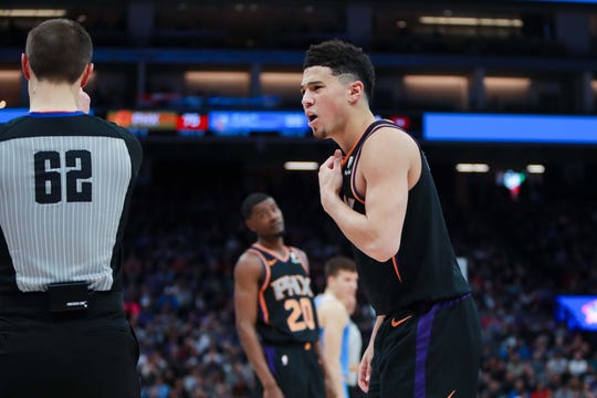 Feb 10, 2019; Sacramento, CA, USA; Phoenix Suns guard Devin Booker (1) argues a call with referee JB DeRosa (62) during the fourth quarter against the Sacramento Kings at Golden 1 Center.