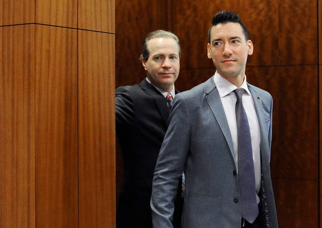 FILE - In this April 29, 2016, file photo, David Daleiden, right, leaves a courtroom with attorney Jared Woodfill after a hearing in Houston. Planned Parenthood has made an unusual legal demand to join California's criminal prosecution of two anti-abortion activists charged with invasion of privacy for secretly making videos as they tried to buy fetal material from the organization. (AP Photo/Pat Sullivan, File)