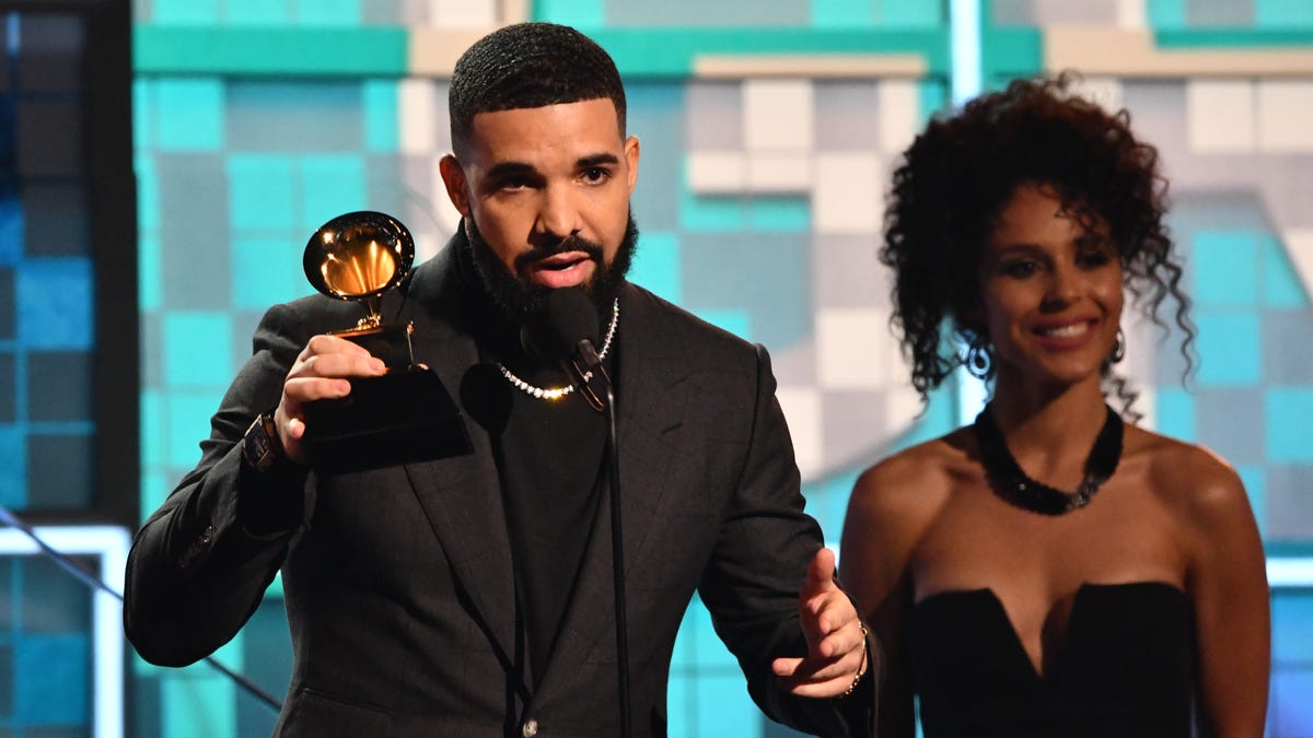 Surprise! Drake shows up to accept best rap song at the Grammys for "God's Plan." But his speech got cut off.