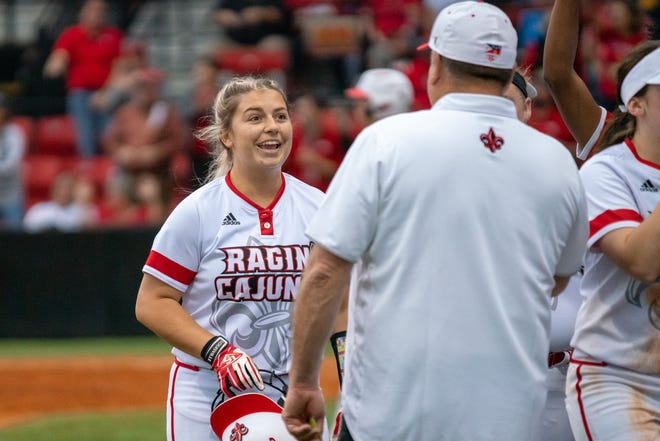 UL's Lexie Comeaux celebrates with head coach Gerry Glasco after hitting her third homerun of the season as the Ragin' Cajuns play against the California Golden Bears at Lamson Park on February 11, 2019.