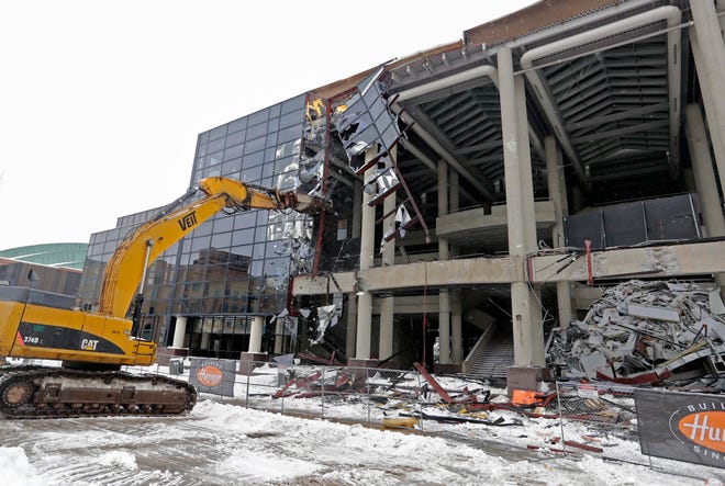 The glass facade on the front of the Bradley Center is shattered Tuesday as demolition continues.