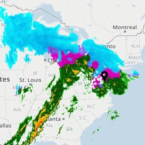 USA TODAY's Weather page shows a storm moving...