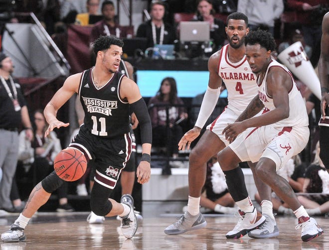 Feb 12, 2019; Starkville, MS, USA; Mississippi State Bulldogs guard Quinndary Weatherspoon (11) dribbles the ball as Alabama Crimson Tide guard Tevin Mack (34) defends during the second half at Humphrey Coliseum. Mandatory Credit: Justin Ford-USA TODAY Sports