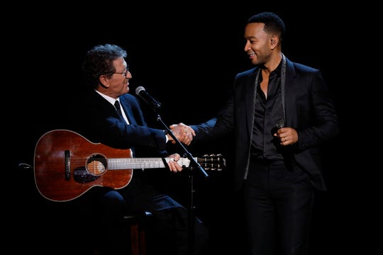 Mac Davis and John Legend perform on stage at 