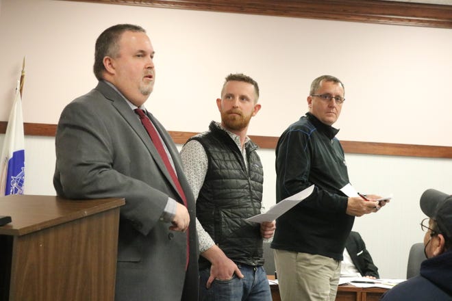 Mike Snider, Mike Roder and Mike Zipfel, of the MORA Committee, present their proposal for a designated outdoor refreshment area in Port Clinton to city council members on Tuesday.
