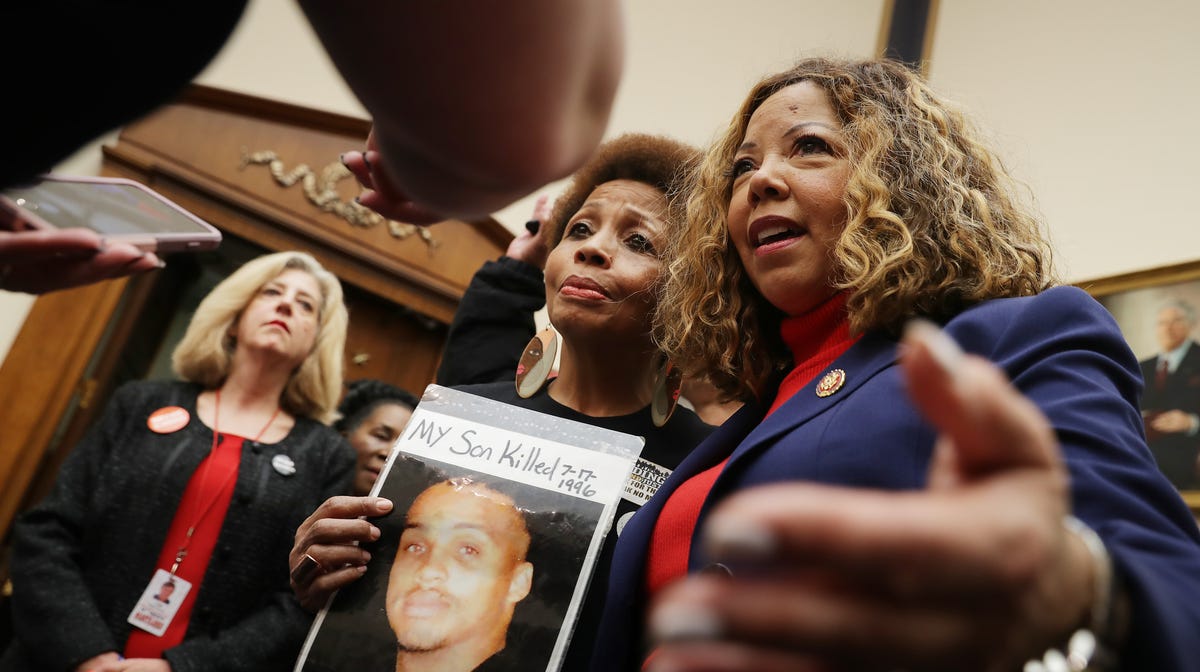 The Brady Campaign's Mattie Scott (C) and Rep. Lucy McBath (D-GA), both of who lost sons to gun violence, pose for photographs before a hearing on gun violence legislation on February 06, 2019.