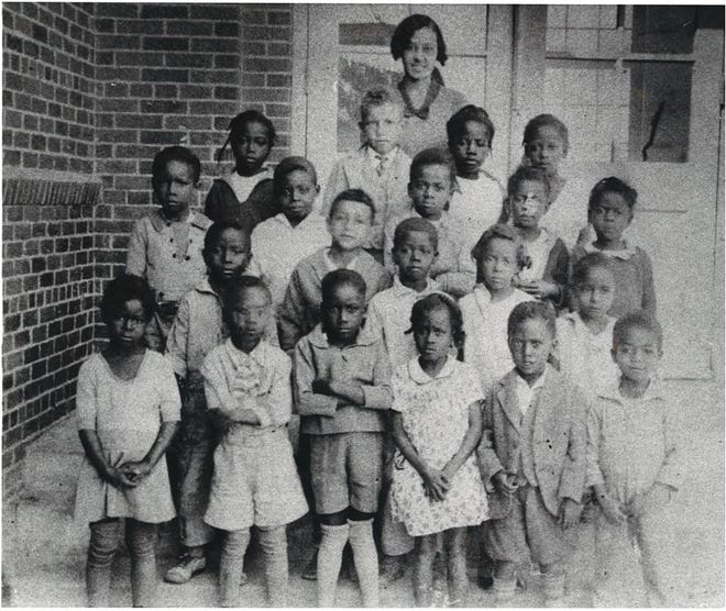 In this 1930 photo, students of Solomon Coles Elementary School pose for a class photo.