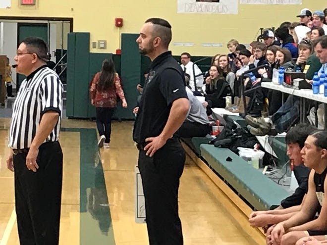 Heart Butte Warriors' head basketball coach Kellen Hall looks out at his team in the waning moments of his team's 54-28 win over Dutton-Brady at the District 10C Tournament at CMR Wednesday evening.