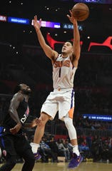 Feb 13, 2019; Los Angeles, CA, USA; Phoenix Suns guard Devin Booker (1) loses the ball against LA Clippers guard Patrick Beverley (21) in the first half at Staples Center. Mandatory Credit: Richard Mackson-USA TODAY Sports