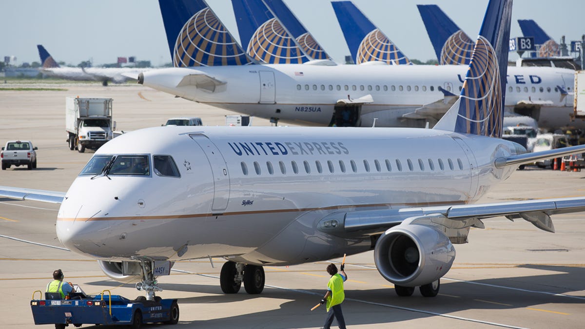 A United Express Embraer E170/75 is pushed back for departure from Chicago O'Hare International Airport in June 2015.