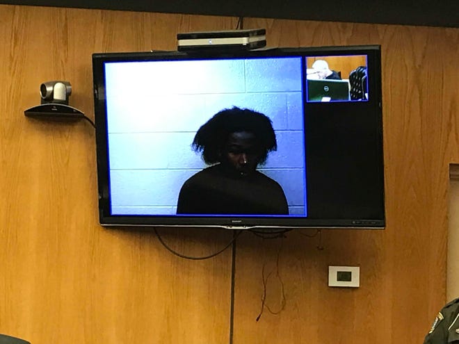 William Davis is arraigned Feb. 15 in Warren District Court on charges connected to the hit-and-run death of a Roseville bicyclist Feb. 3.