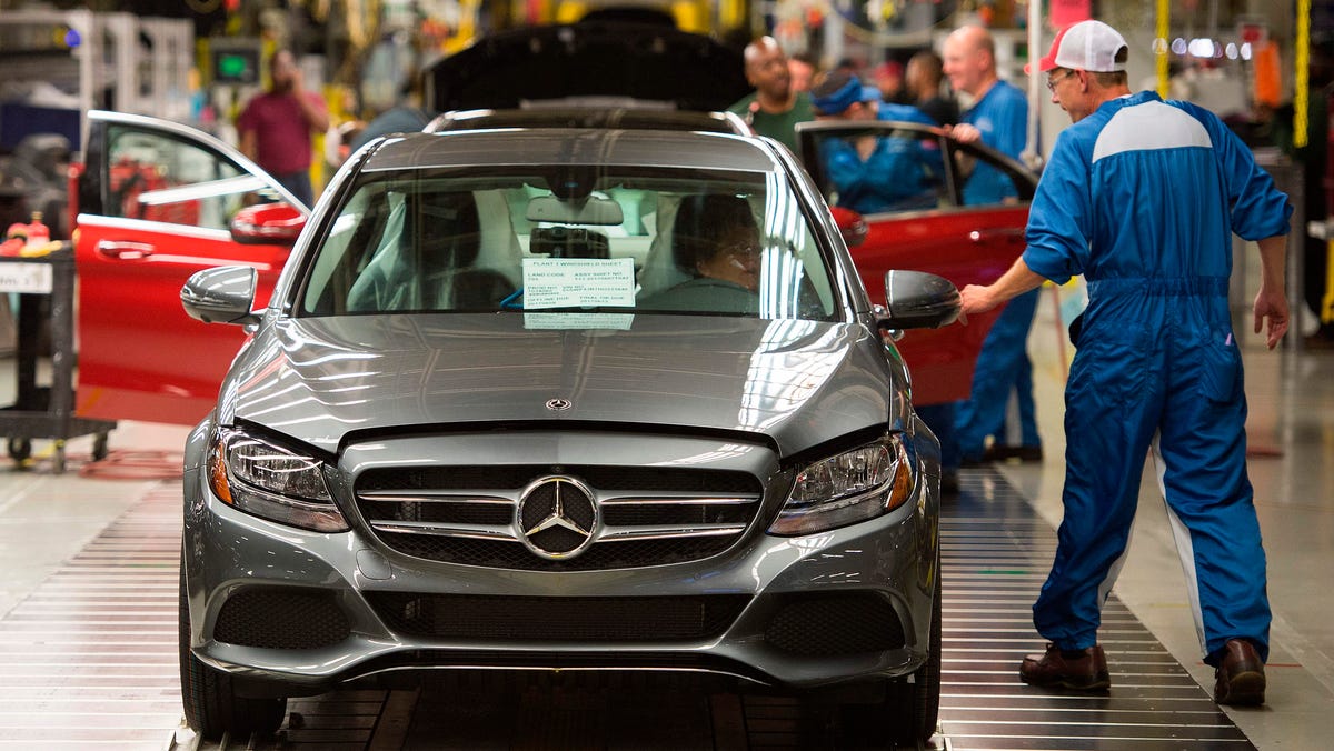 Economists say new tariff costs between ,000 to ,000 per vehicle Economists say new tariff costs between ,000 to ,000 per vehicle