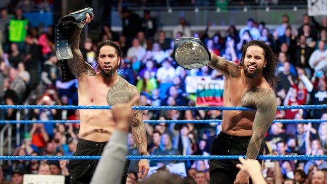 Jimmy Uso, left, was arrested in Detroit late Thursday evening.