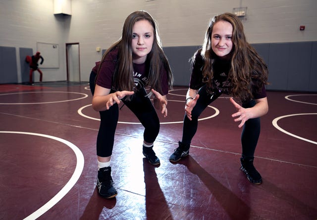 Isabella Campbell, left, and Annalise Dodson are the first girls to wrestle for Franklin High School.