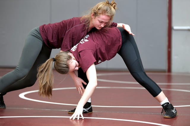 Annalise Dodson and Isabella Campbell practice in the Franklin High School gym on Feb. 13. They are the first girls wrestlers to compete for FHS.