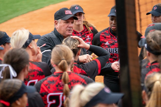 UL softball coach Gerry Glasco talks to his players outside of the dugout Feb. 16 against Stephen F. Austin at Lamson Park.