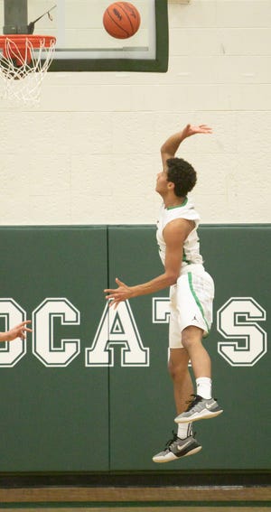 Novi's Jett Porter scores two of his eight first-half points in a 57-45 loss to Howell on Friday, Feb. 15, 2019.