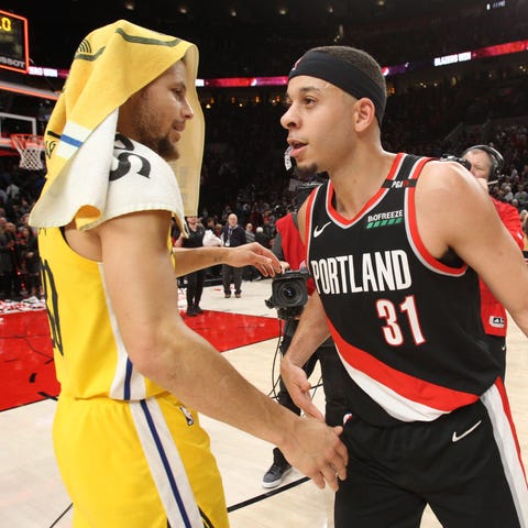 Stephen Curry and brother Seth Curry meet after a...