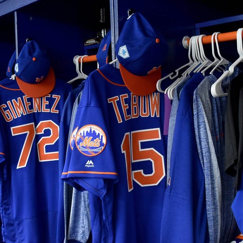 Tim Tebow's jersey hangs in the Mets locker room.