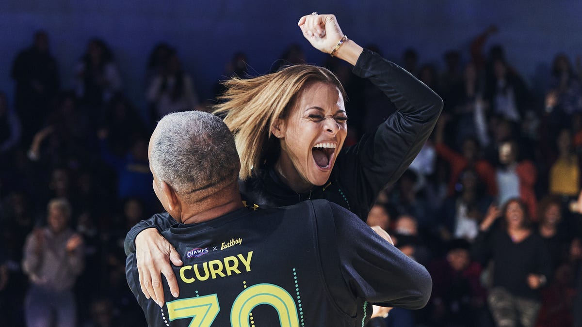 Sonya Curry celebrates her halfcourt shot with husband Dell.