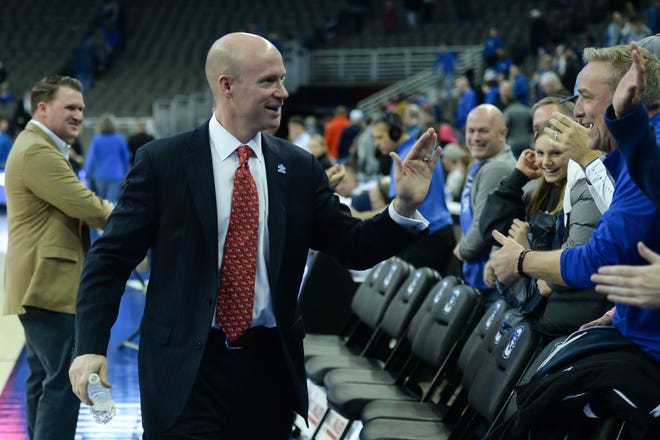 Seton Hall Pirates head coach Kevin Willard greets fans after the win against the Creighton Bluejays