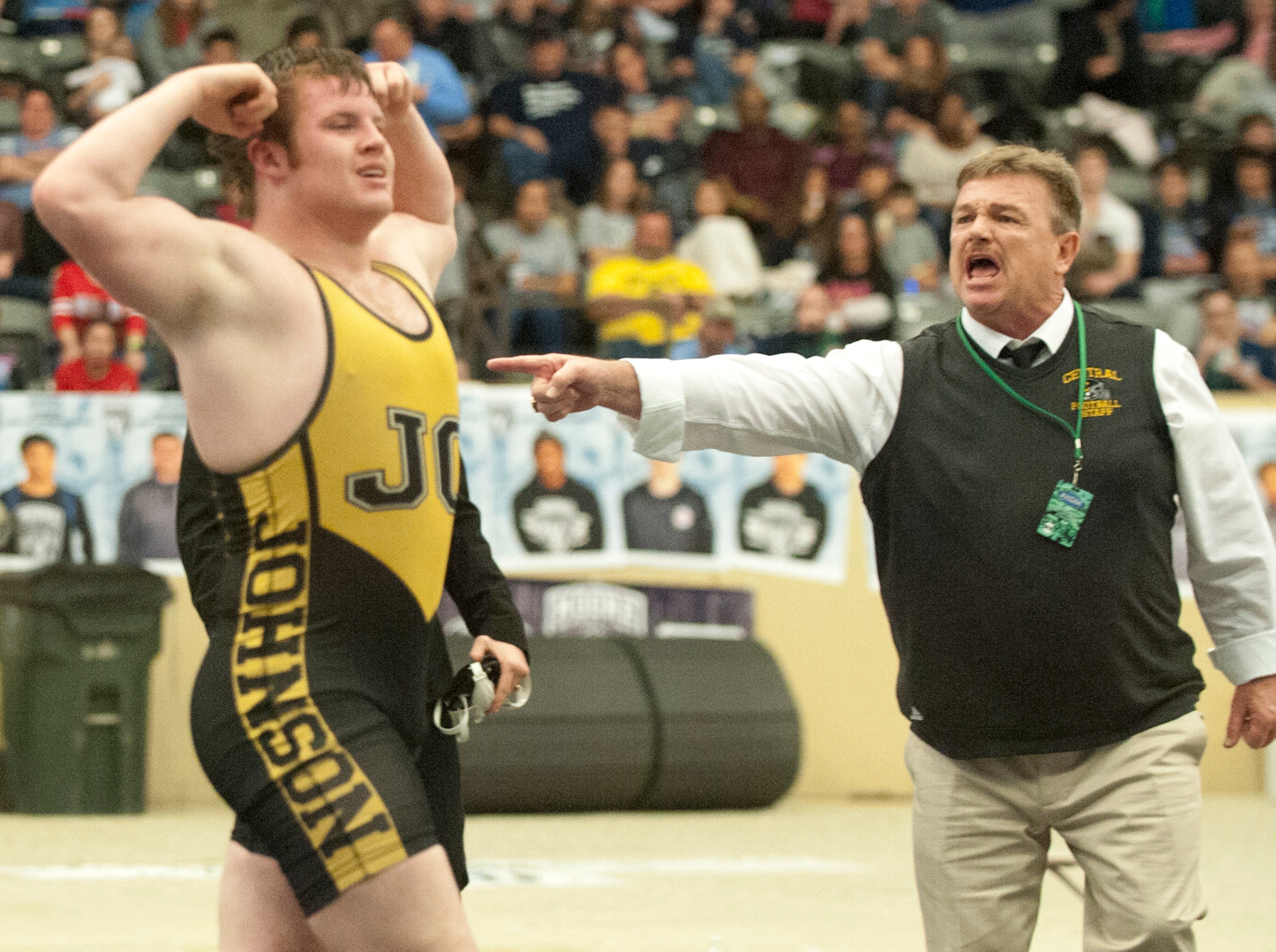 Johnson Central's Matthew Horn raises his arms up in triumph after defeating St. Xavier's Ben DePrest 3-2 in a tie-breaker of the 195 lb. contest of the KHSAA wrestling championship,16 February 2019