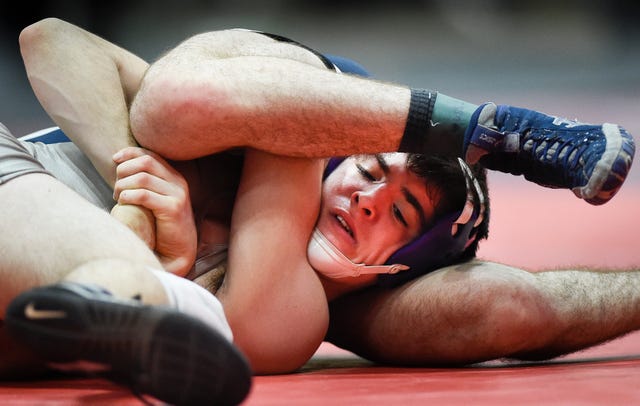Lawrence Madson of Father Ryan tries to escape James Whitworth of McCallie during the TSSAA 2019 Wrestling State Championships at the Williamson County Ag Expo Park Saturday, Feb. 16, 2019 in Franklin, Tenn.