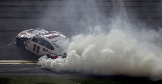 Denny Hamlin burns his tires after winning the Daytona 500.