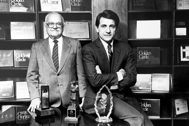 In this photograph dated to 1984, Charles Tombras Sr., left, founder of The Tombras Group is pictured with his son Charles Tombras Jr. at their offices on Concord St.