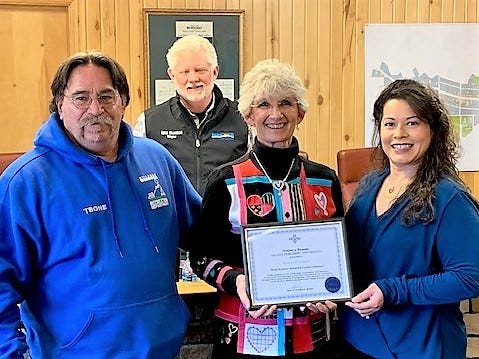 Ruidoso Councilor Susan Lutterman, center, received an award for her volunteer work with Keep Ruidoso Beautiful from David Tetreault of Parks and Recreation and KRB committee chairman Reyna Flores. In back is Mayor Lynn Crawford.