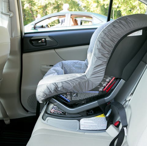 The 2013 Subaru Impreza with a car seat inside.