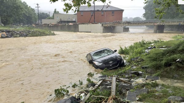 A vehicle ends up in a stream near White Sulphur...