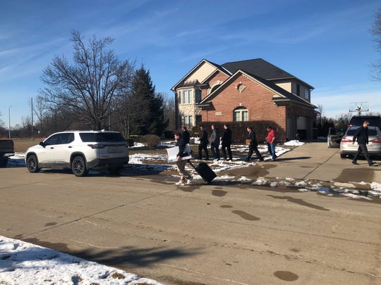 FBI agents were spotted leaving Mayor Rick Sollars' home after 2 p.m. carrying boxes and folders and a backpack.