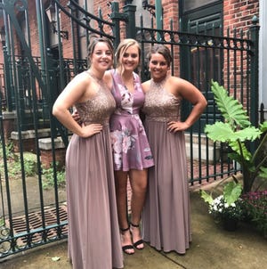 Meghan Hadley, Emma Hosey and Victoria Skoog, from left, are the organizers behind a prom dress sale that will benefit the family of Lindsey Gies.